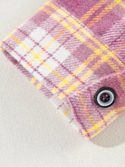 Oversized shacket with pink, yellow, and white plaid pattern and button cuff detail.