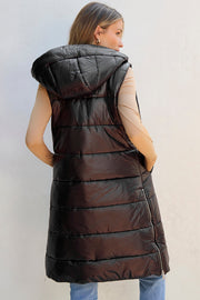 Longline hooded puffer vest in black with quilted detailing and a zipper closure.