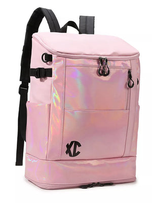 Pink travel organizer bag with iridescent panel and buckle closure.