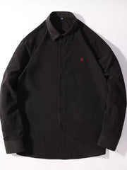 Black casual button-up shirt with red embroidered logo on chest.