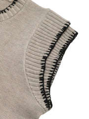 Beige knit top with cap sleeves and black stitched edge detail.