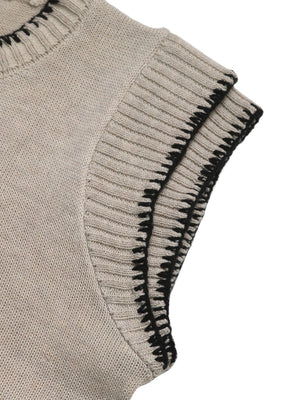 Beige knit top with cap sleeves and black stitched edge detail.