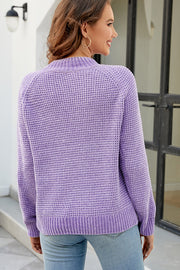 Lavender waffle knit raglan sleeve pullover sweater with ribbed cuffs and hem.