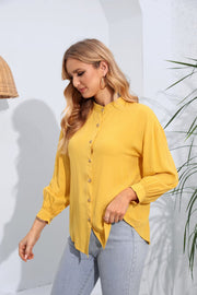 Yellow mandarin collar blouse with button front and gathered sleeves.