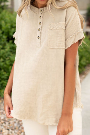 Beige textured gauze henley blouse with raw edges and a chest pocket.