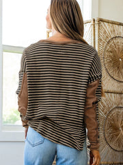 Casual drop shoulder knit top with horizontal stripes and contrast sleeves.