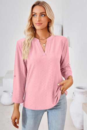 Blush pink textured henley shirt with V-neck and roll-tab sleeves