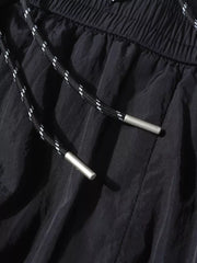 Black wide-leg cargo pants with drawstring and metal tips, elastic waistband.