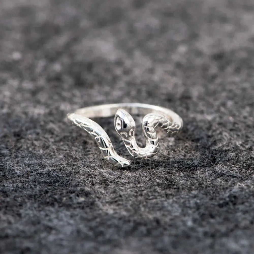 Serpentine Embrace silver ring with detailed snake design, made of 925 sterling silver.