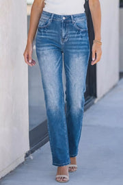 Acid-washed straight-leg denim jeans with distressed details and a gradient fade.