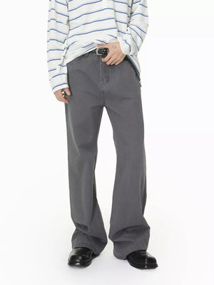 Men's relaxed fit grey cotton jeans with a buttoned fly and flared leg