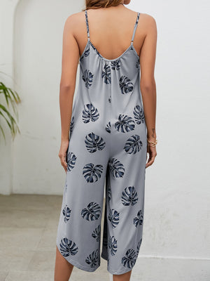 Monstera print culotte jumpsuit in Gray Dawn with gathered bust and spaghetti straps.