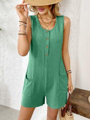 Green ribbed knit button-front romper with scoop neck, sleeveless, and pockets.