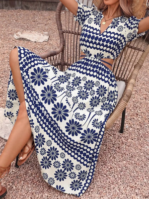 Maxi dress with blue floral print, cutout waist, and short sleeves.