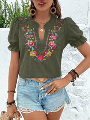 Army green blouse with floral embroidery, puff sleeves, and a V-neck.