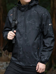 Black windbreaker jacket with marble pattern, hood, and zippered pockets.