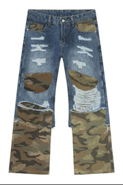 Camouflage patchwork distressed jeans in medium wash denim with baggy fit.