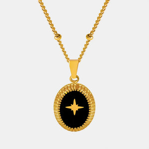 Gold celestial starburst oval pendant necklace with black inlay