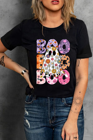 Black t-shirt with a floral ghost graphic and "Boo" text in Halloween patterns.