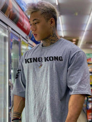 Gray oversized graphic tee with King Kong text and short sleeves.