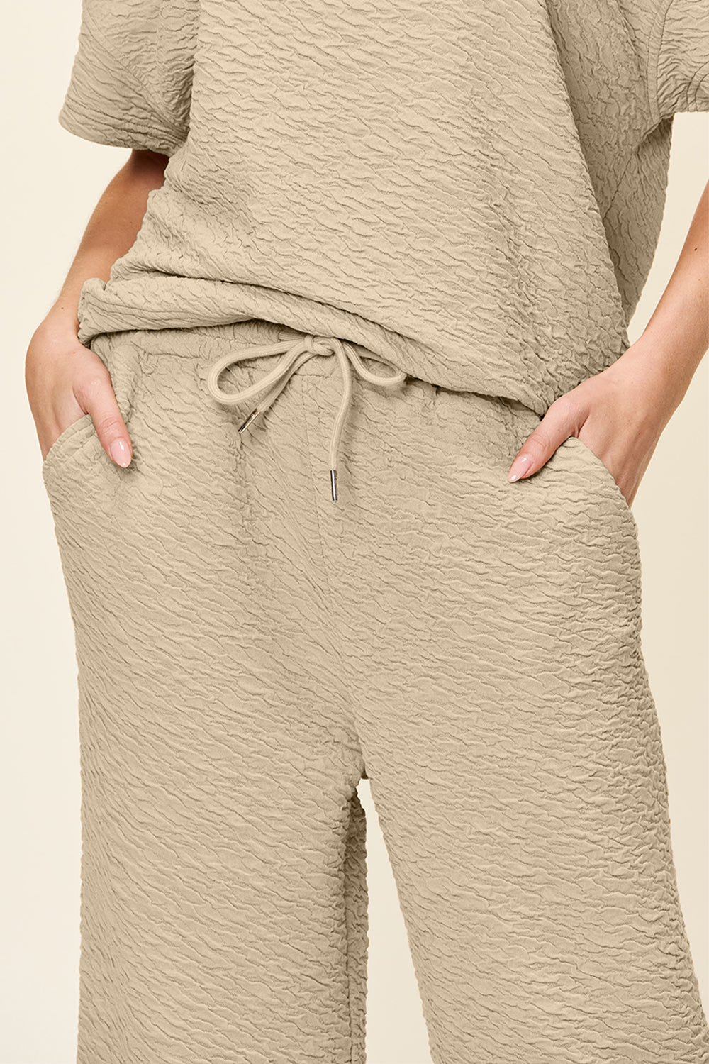 Textured cocoon top and wide leg pants set in khaki with drawstring waist and pockets.