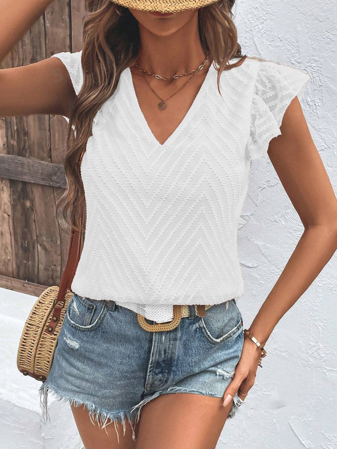 White textured chevron V-neck blouse with flutter sleeves