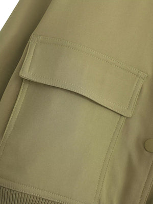Boxy bomber jacket in moss green with flap pocket detail and ribbed hem.