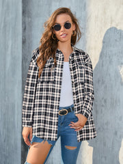 Black and white plaid shirt with two chest pockets and a button-up front.