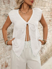 Open-knit sleeveless cardigan in ivory with tie-front detail and V-neck.