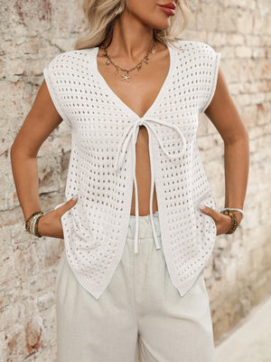 Open-knit sleeveless cardigan in ivory with tie-front detail and V-neck.
