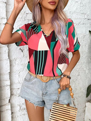 Geometric print V-neck blouse in multicolor with short sleeves.