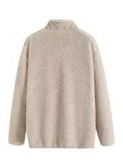 Beige sherpa zip-up jacket with stand collar and long sleeves.
