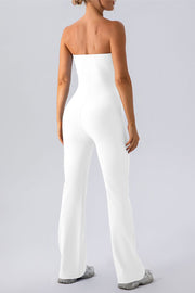 White ribbed bandeau flare leg jumpsuit with a seamless design.
