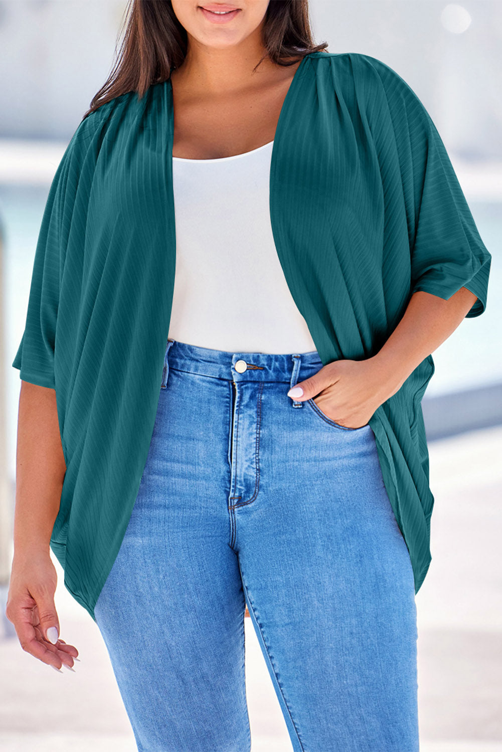 Dark Green ribbed batwing cardigan with drape front, styled with a white tank and jeans.
