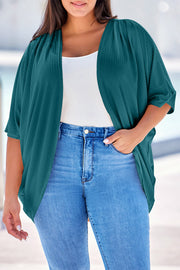 Dark Green ribbed batwing cardigan with drape front, styled with a white tank and jeans.