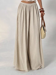 Textured wide-leg maternity pants in beige cotton with a gathered elastic waist.