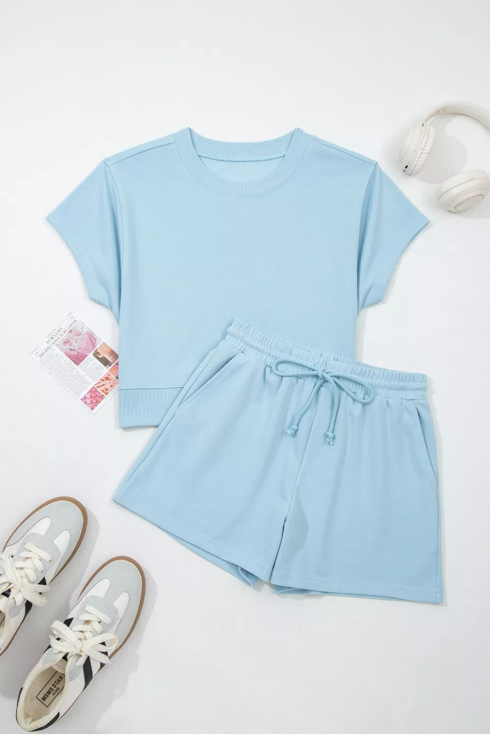 Light blue cotton two-piece set with crew neck tee and drawstring shorts.