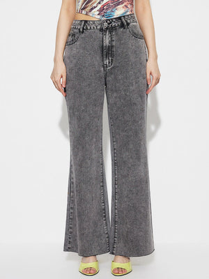 Acid wash flare jeans in dark gray cotton with a high-rise fit and buttoned front.