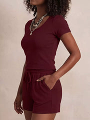 Burgundy scoop-neck tee and drawstring shorts set with pockets.