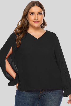 Black V-neck blouse with split sleeves and ruffled cuffs.