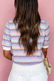 Pastel abstract striped knit sweater with short sleeves and white cuffs.