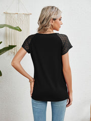 Black polyester blouse with lace short sleeves and a round neckline.