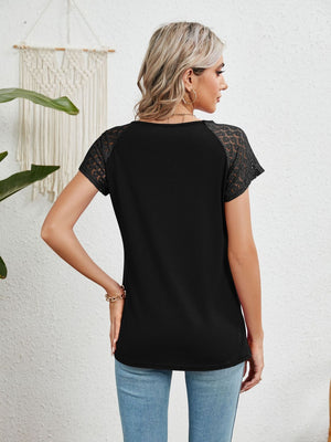 Black polyester blouse with lace short sleeves and a round neckline.