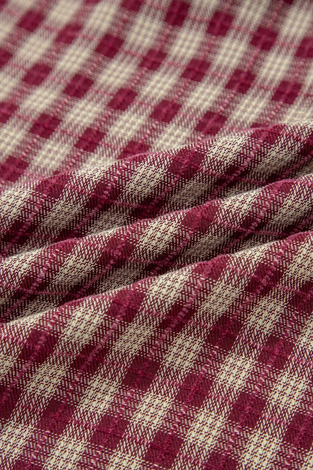 Country plaid blouse in burgundy and cream, showing fabric texture and weave.