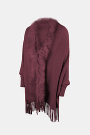 Wine faux fur trimmed fringe cape with long sleeves and a boho style.