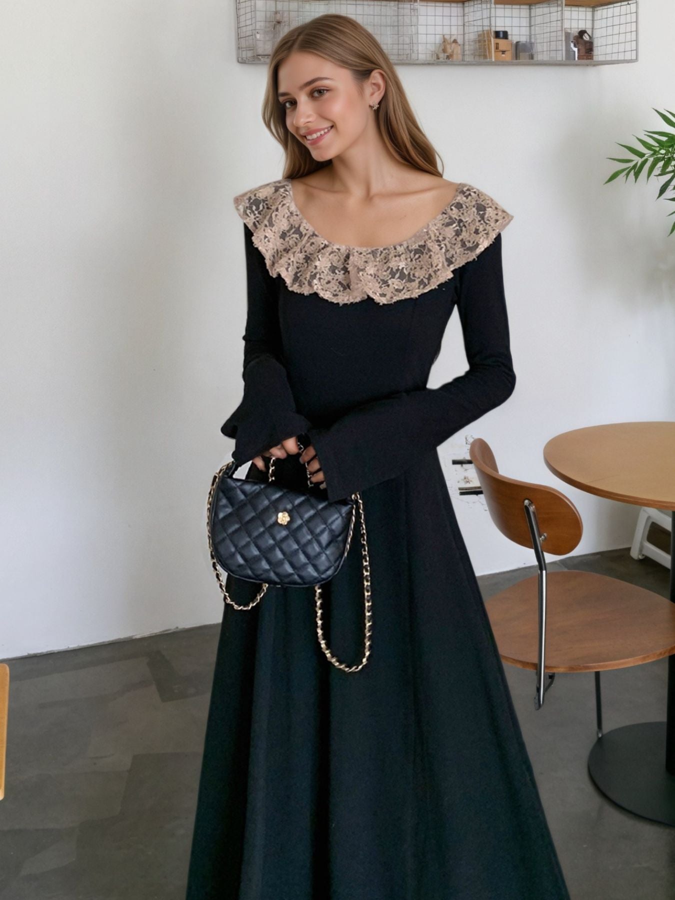 Black A-line dress with lace collar, long bell sleeves, and a quilted handbag.