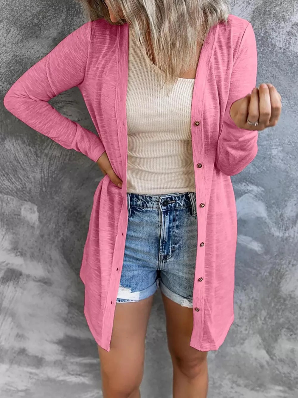 Watermelon pink cotton button-down cardigan with long sleeves and a lightweight feel.