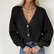 Black ribbed knit cardigan with balloon sleeves and gold buttons