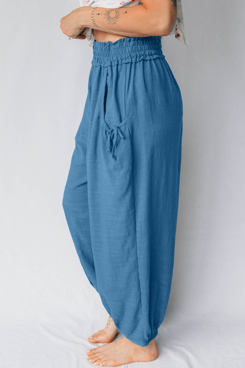 Blue cotton blend jogger pants with smocked waist and drawstring pockets