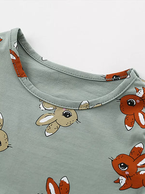 Baby dress with playful bunny print on cotton blend fabric, round neckline.